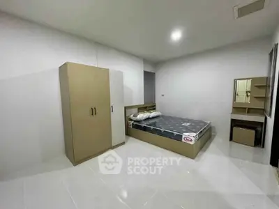 Spacious minimalist bedroom with modern furniture and sleek design