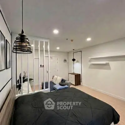 Modern bedroom with stylish lighting and cozy decor in a contemporary apartment.