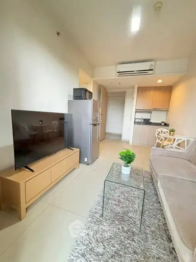 Modern living room with sleek furniture and open kitchen layout