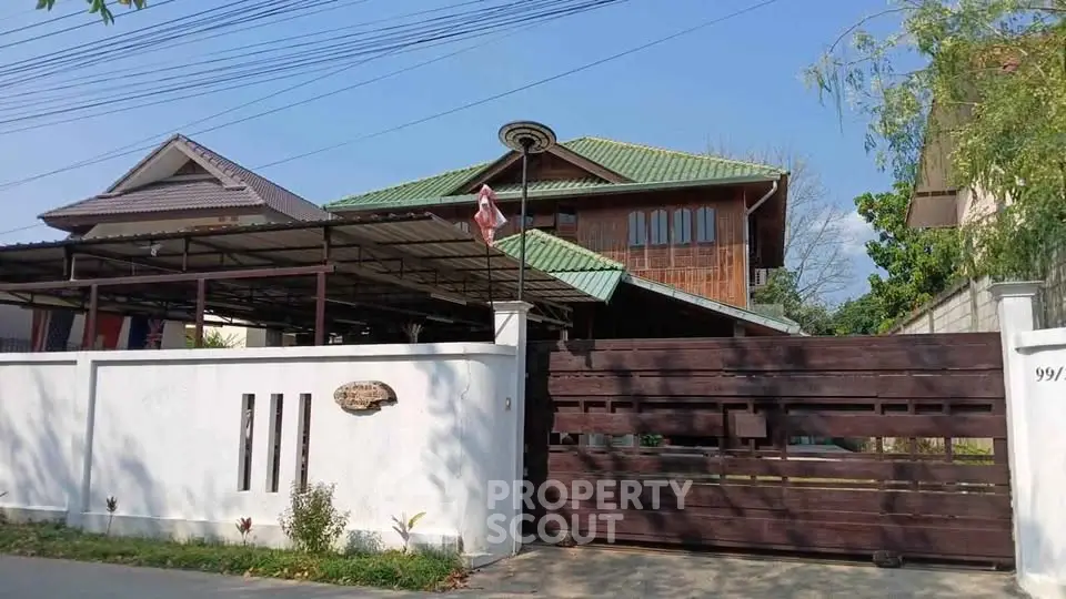 Charming traditional wooden house with green roof and spacious driveway