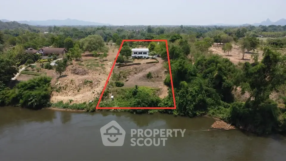 Stunning riverfront property with expansive land and serene views, perfect for a private retreat or development.