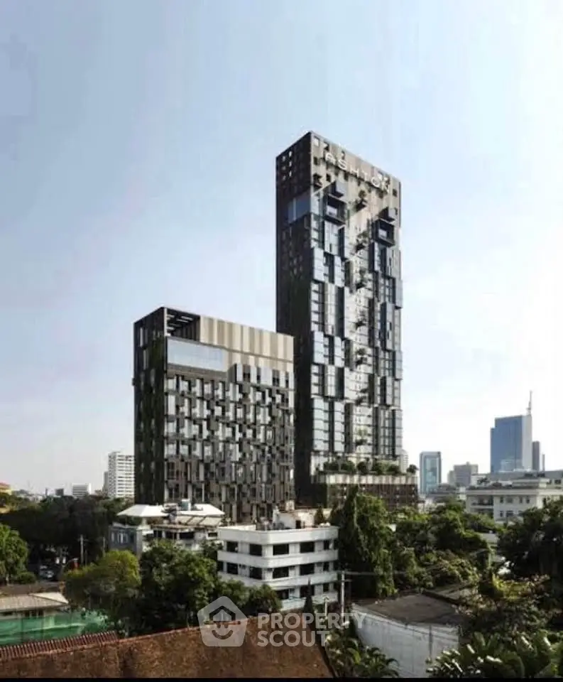 Stunning modern high-rise building with unique architectural design and lush greenery in urban setting.