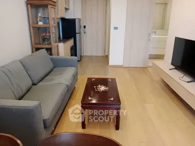 Modern living room with sleek furniture and wooden flooring