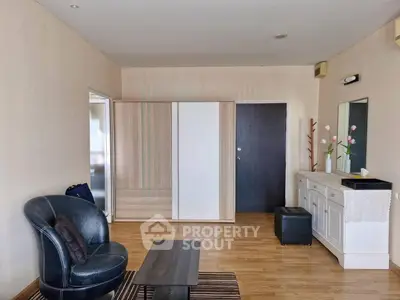 Spacious living room with modern furniture and elegant decor, perfect for relaxation and entertaining.