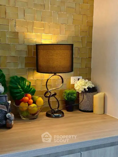 Stylish kitchen counter with modern lamp and fruit bowl