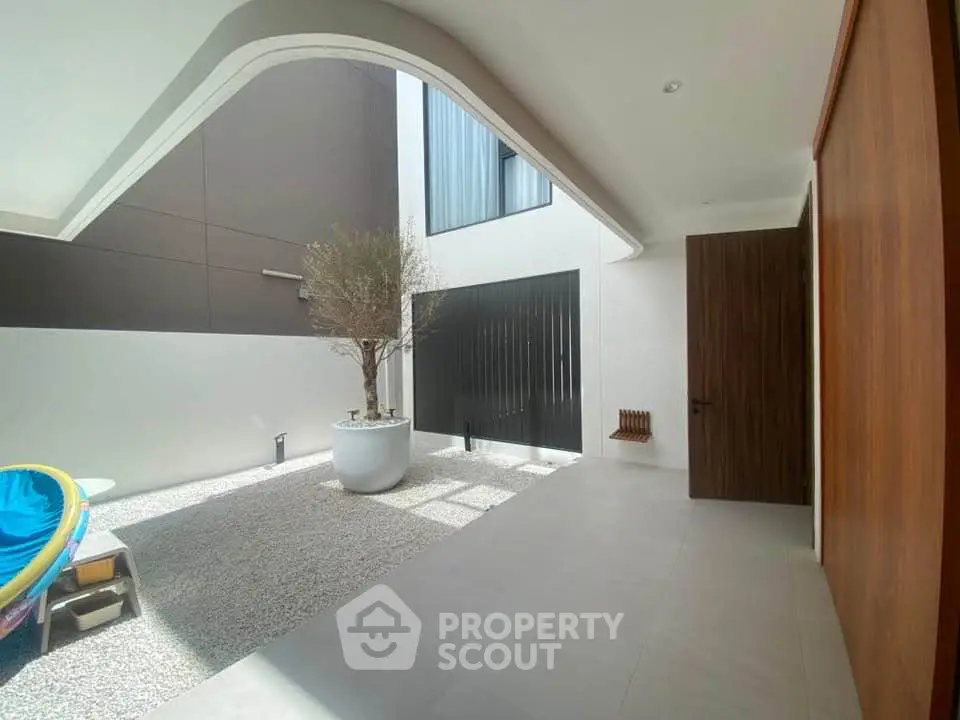 Modern minimalist courtyard with sleek design and natural light