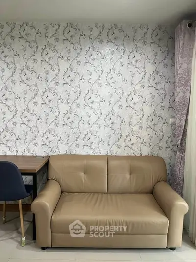 Stylish living room with elegant wallpaper and cozy leather sofa