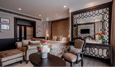 Luxurious living room with elegant decor and plush furniture in a modern apartment.