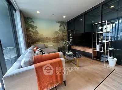 Stylish living room with modern decor and large windows offering natural light.