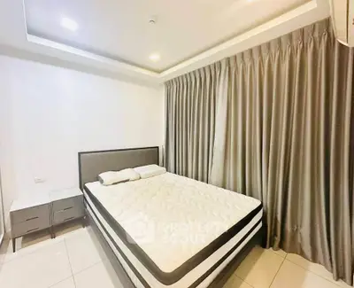 Modern bedroom with sleek design and elegant curtains