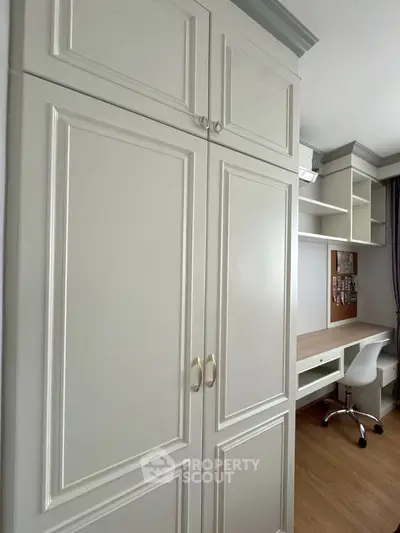 Modern study room with built-in wardrobe and sleek desk setup