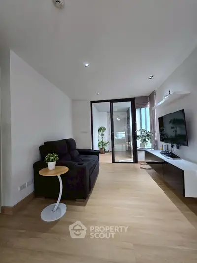 Modern living room with sleek design and natural light