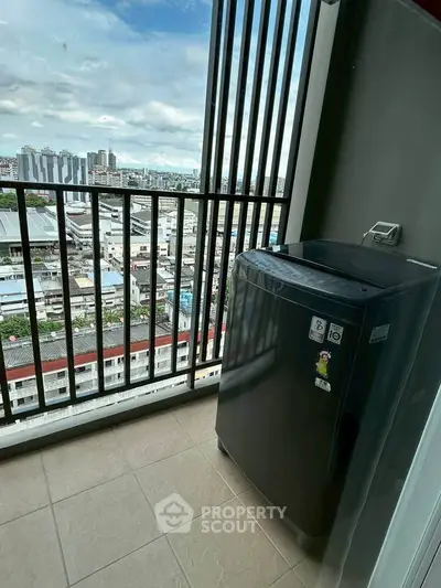 High-rise balcony with city view and washing machine setup.