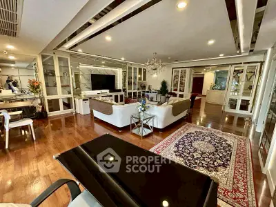 Luxurious living room with elegant decor, spacious layout, and hardwood floors in a modern apartment.