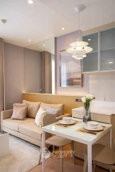 Chic modern living room with cozy dining area and elegant lighting, perfect for urban living.