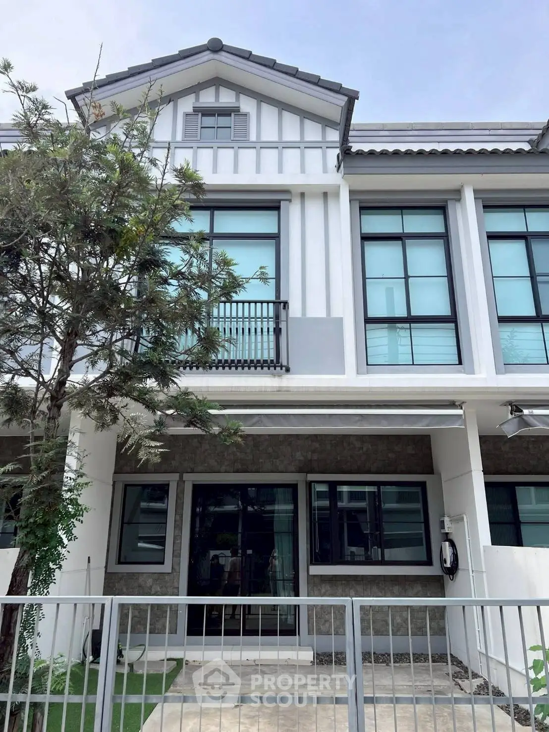 Modern townhouse exterior with large windows and stylish facade
