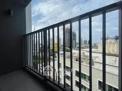 Spacious balcony with city skyline view, perfect for urban living enthusiasts.
