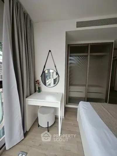 Modern bedroom with stylish decor and natural light