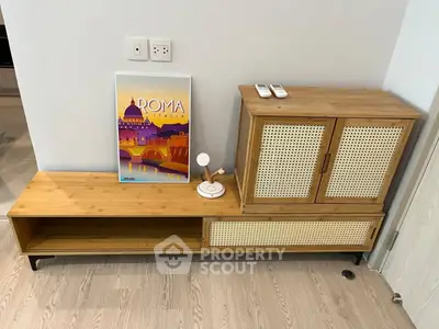 Stylish modern living room with wooden furniture and Roma Italia poster, perfect for contemporary homes.