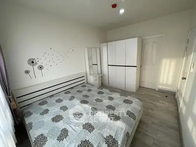 Bright and airy bedroom with modern decor and ample natural light.