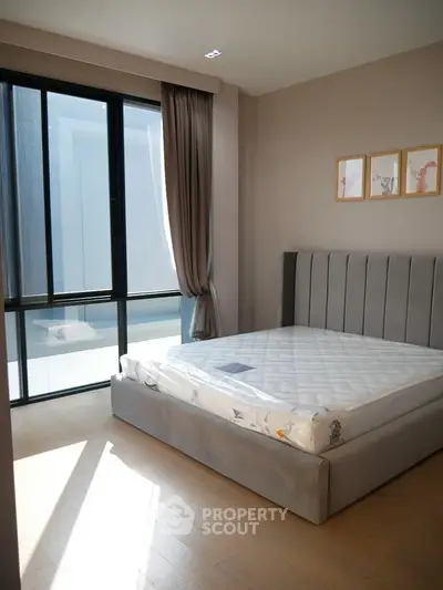 Modern bedroom with large window and stylish decor