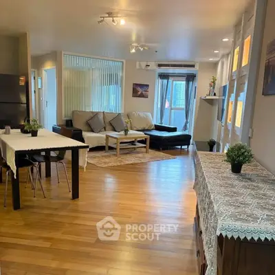 Spacious modern living room with wooden flooring and stylish decor