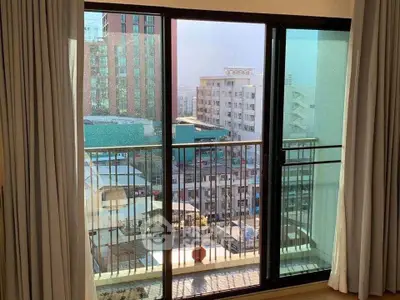 Spacious balcony with city view from modern apartment, perfect for urban living.