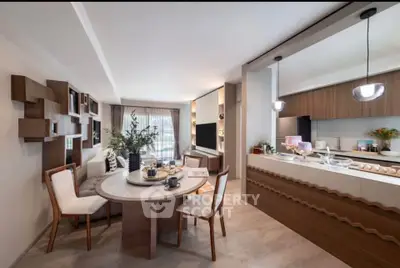 Modern open-plan kitchen and dining area with stylish decor and natural light.