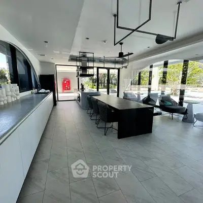 Modern open-layout kitchen with sleek design and outdoor view