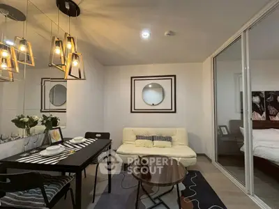 Modern living room with stylish lighting and cozy dining area