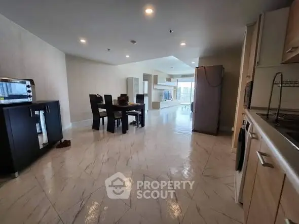 Spacious open-plan living area with modern kitchen and dining space.