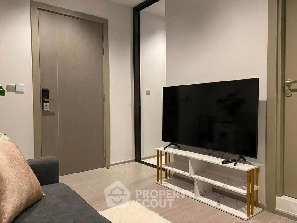 Modern living room with sleek TV and stylish decor