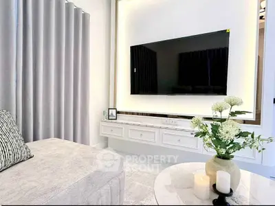 Modern living room with sleek TV setup and elegant decor