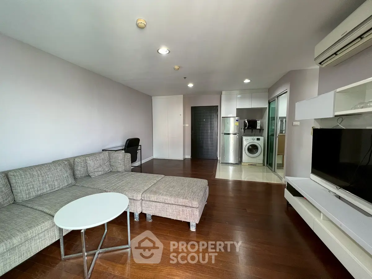 Spacious modern living room with open layout and sleek furniture