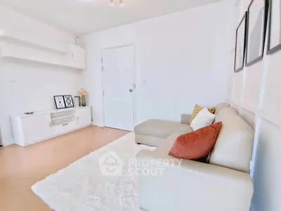 Bright and cozy living room with modern decor and comfortable seating.