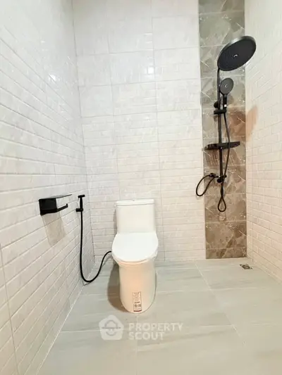 Modern bathroom with sleek shower and contemporary toilet design
