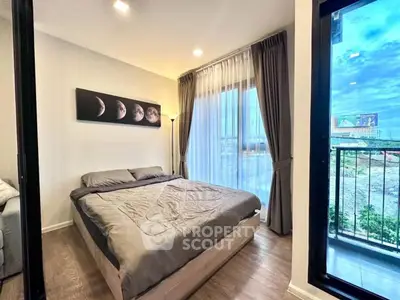 Modern bedroom with large windows and balcony view
