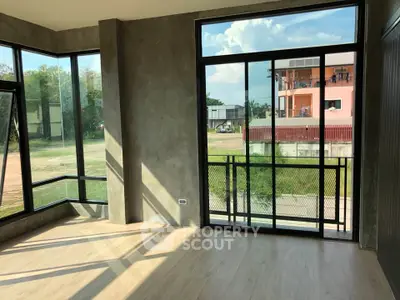 Modern corner unit with large windows and balcony, offering abundant natural light and scenic views.