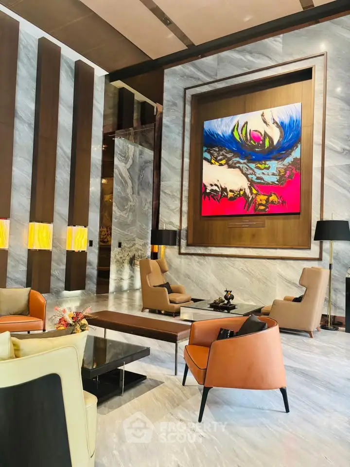 Luxurious modern lobby with elegant seating and vibrant artwork, perfect for upscale living.