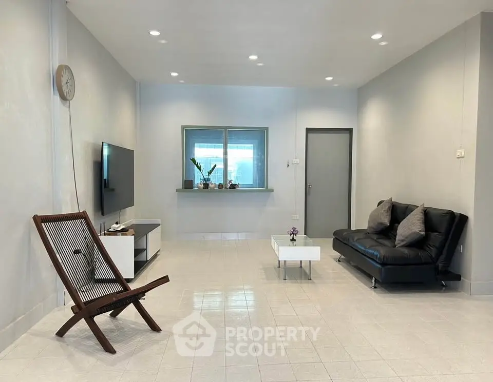 Spacious modern living room with sleek furniture and minimalist design