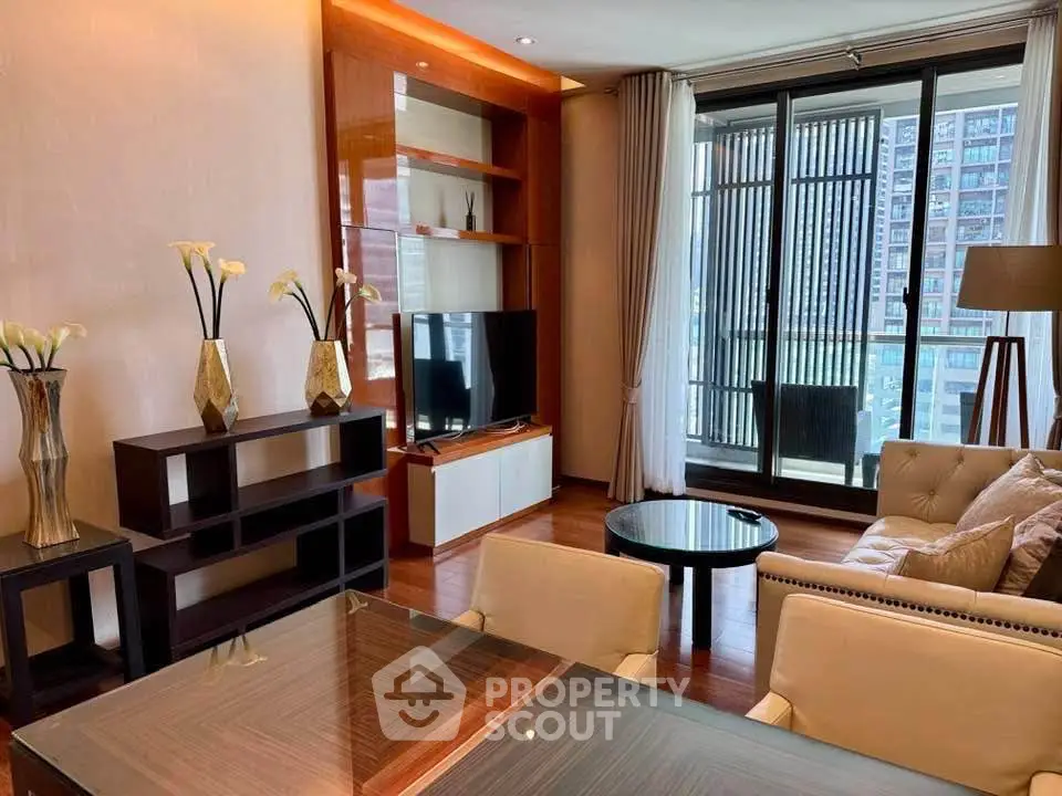 Luxurious living room with modern decor and city view balcony in upscale apartment.