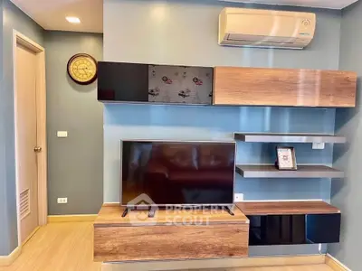 Modern living room with stylish wooden shelves and mounted TV, featuring sleek air conditioning unit.