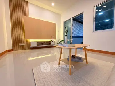 Modern living room with sleek design and ambient lighting
