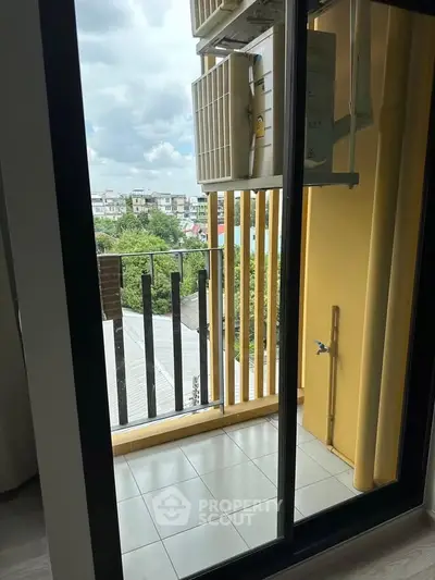 Charming balcony with city view, perfect for relaxation and enjoying the outdoors.