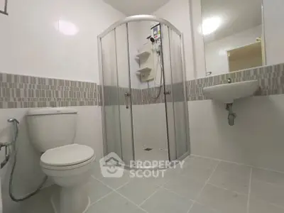 Modern bathroom with shower enclosure and sleek fixtures