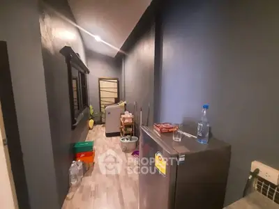 Cozy hallway with modern decor and compact refrigerator in stylish apartment.