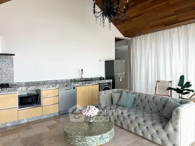 Luxurious open-plan living room with modern kitchen and elegant decor