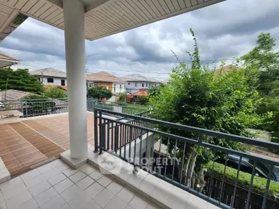 Spacious balcony with scenic view in a modern residential area, perfect for relaxation and outdoor activities.