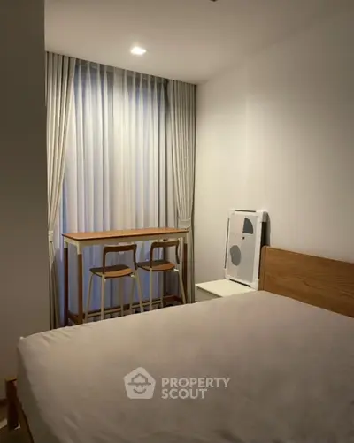 Cozy bedroom with modern decor and natural light