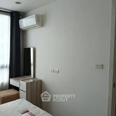 Modern bedroom with air conditioning and stylish furniture in a bright apartment.